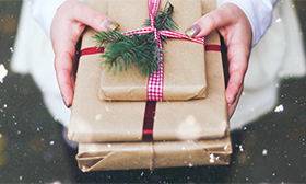 A person handing over gifts